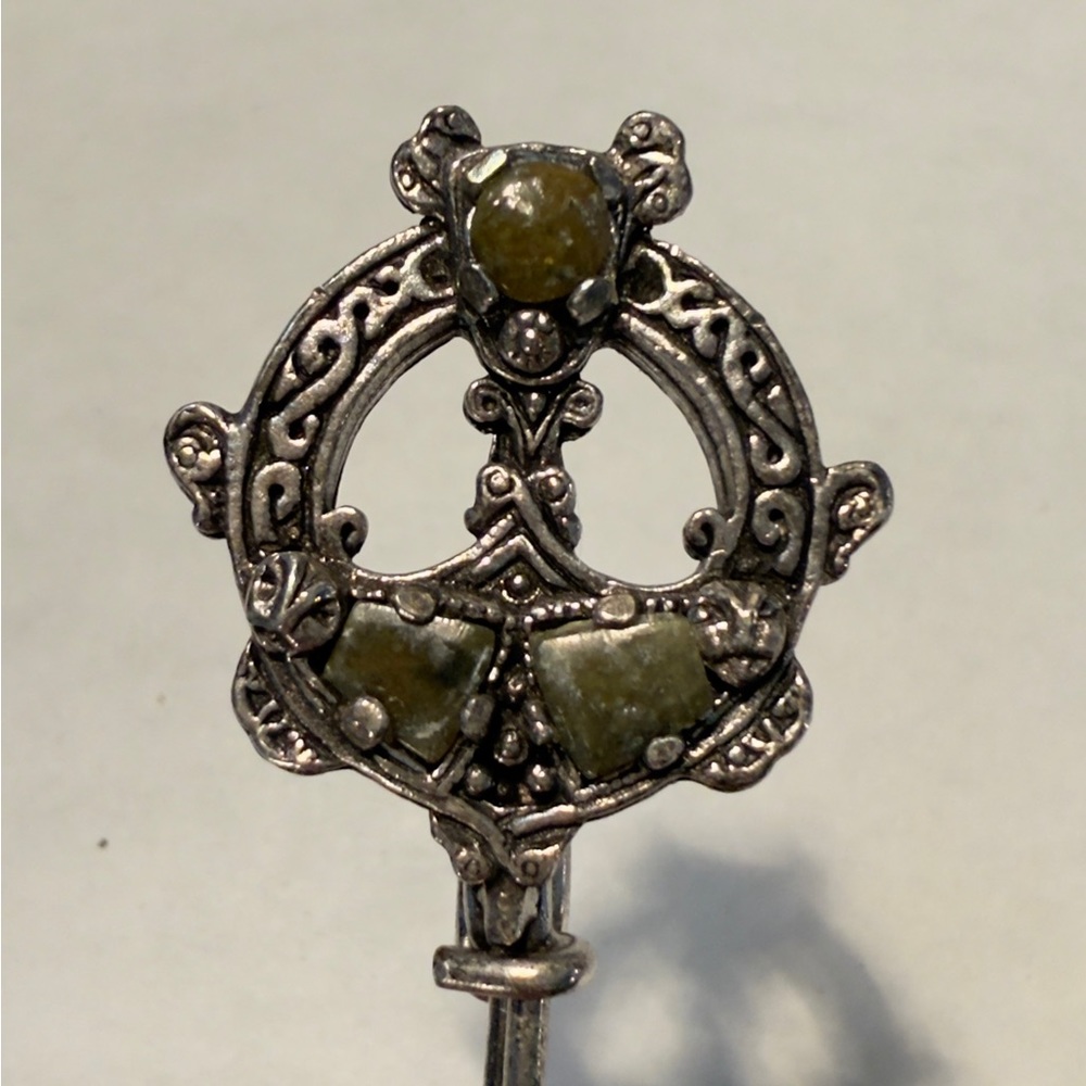 Elegant Silver Brooch with Green Accents